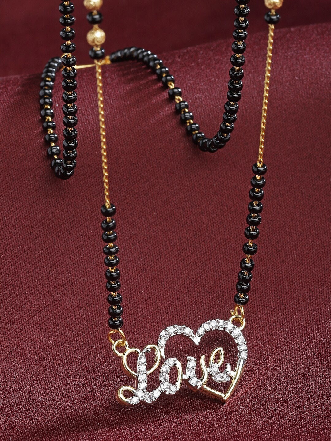 

Aazeen Gold Plated American Diamond-Studded & Beaded Mangalsutra