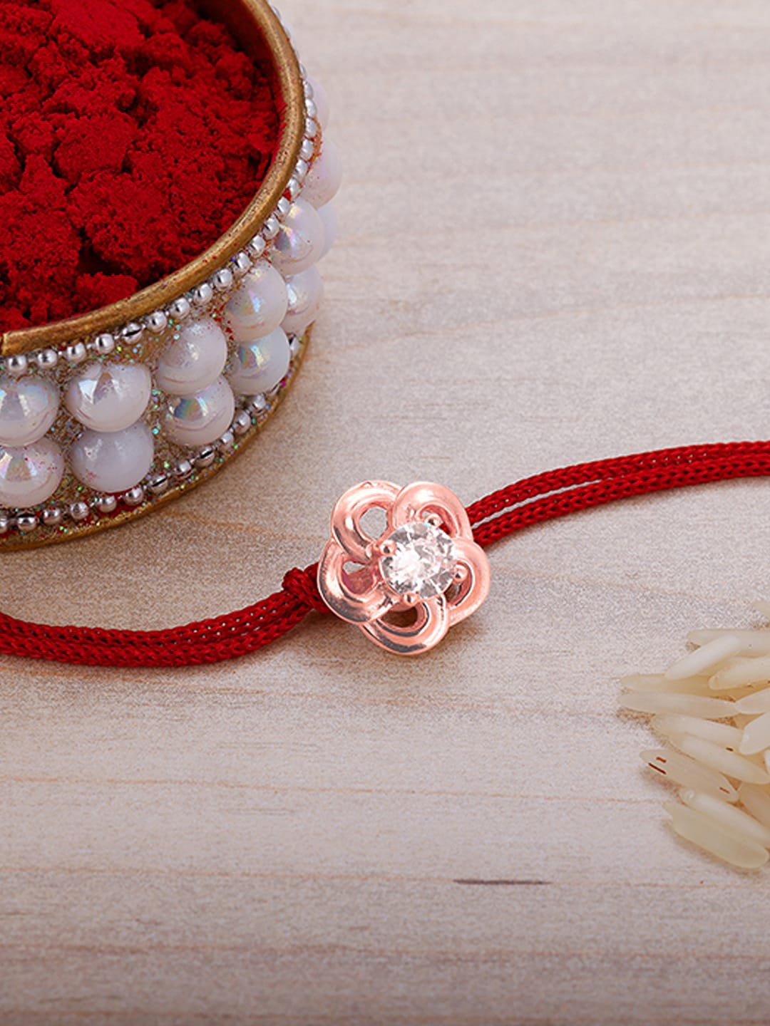 

GIVA 925 Sterling Silver Rose Gold Flower Rakhi With Roli Chawal