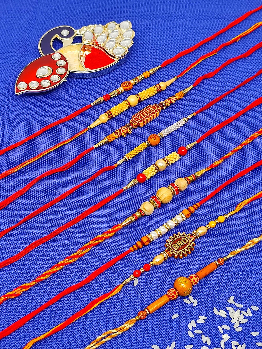 

CRAYTON Set of 9 Thread Rakhi With Roli Chawal Holder, Red