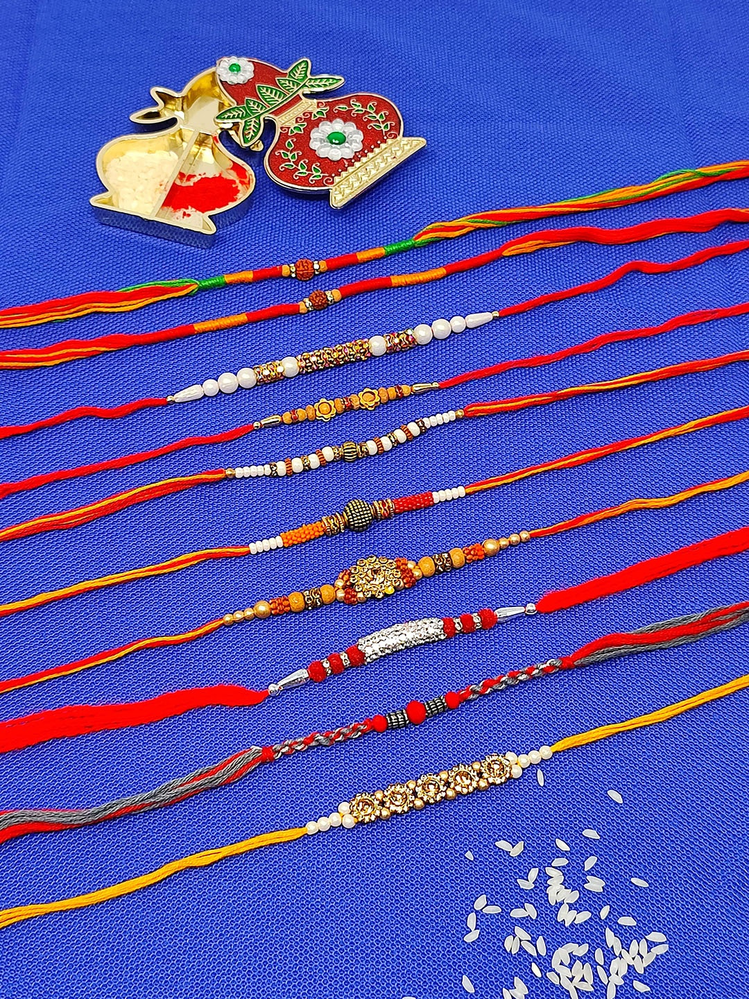 

CRAYTON Set of 10 Beaded Thread Rakhi, Red