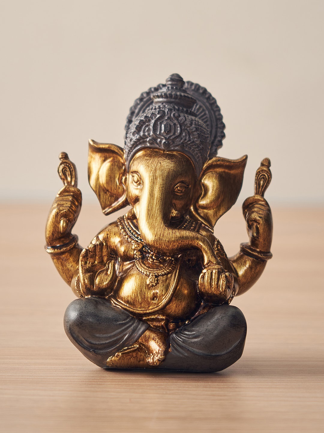 

Pure Home and Living Brown Textured Sitting Ganesha Showpiece