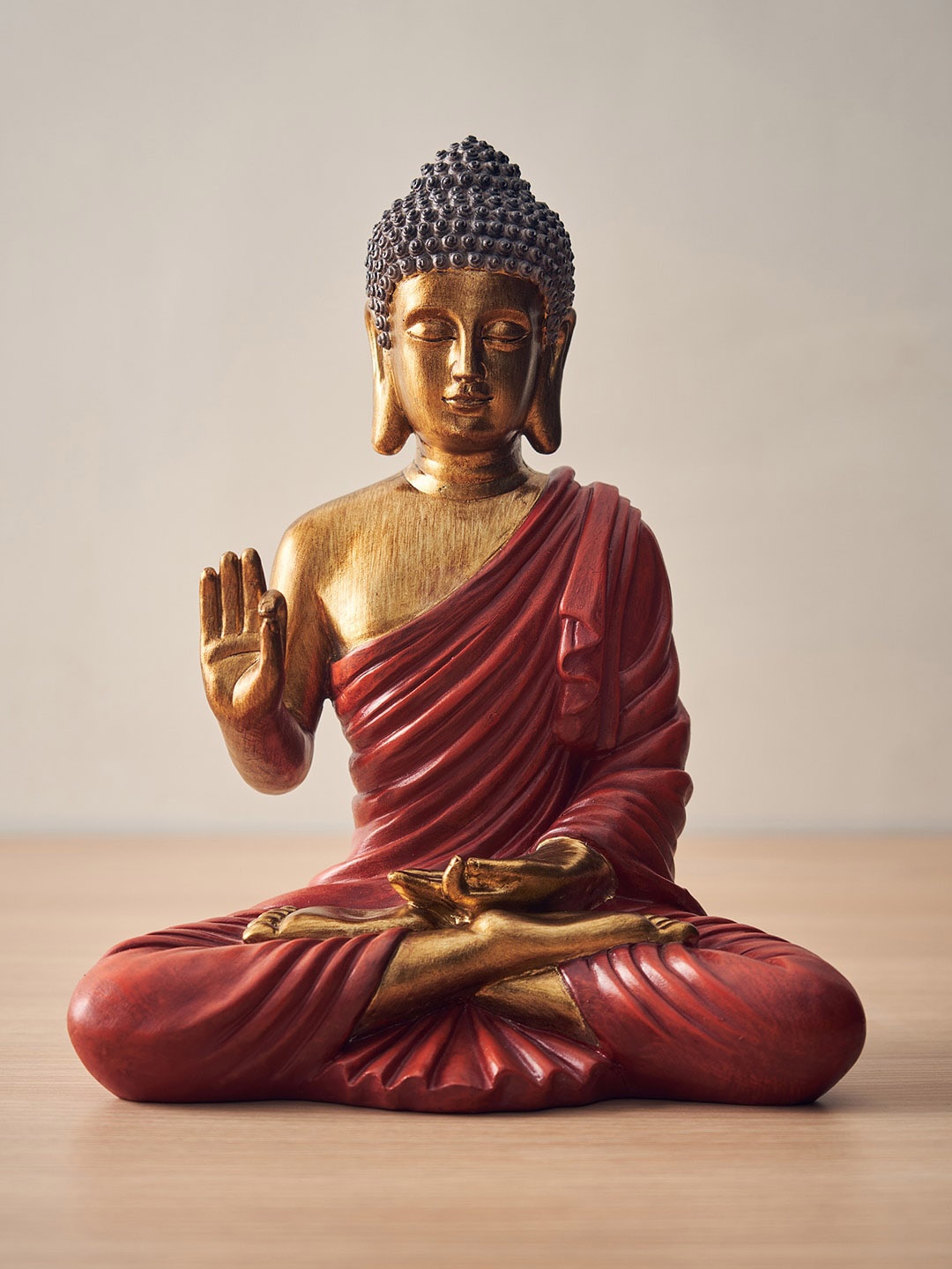 

Pure Home and Living Red & Brown Textured Buddha Idol Showpiece