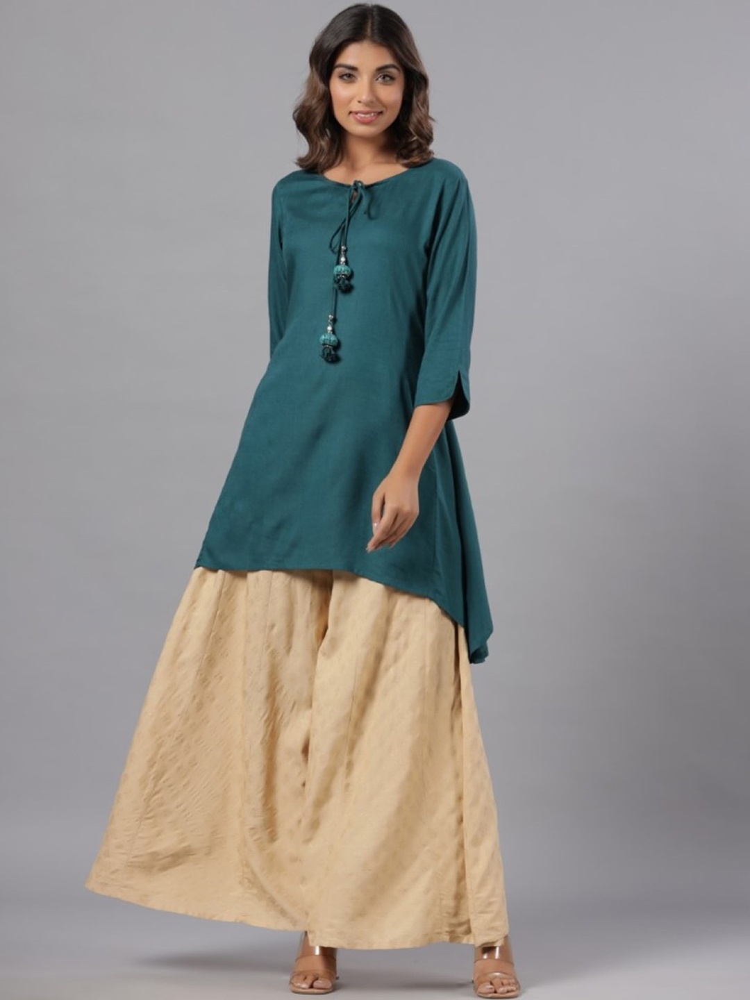 

Juniper Teal Green Tie-Up Neck Three-quarter Sleeves A-Line Kurta