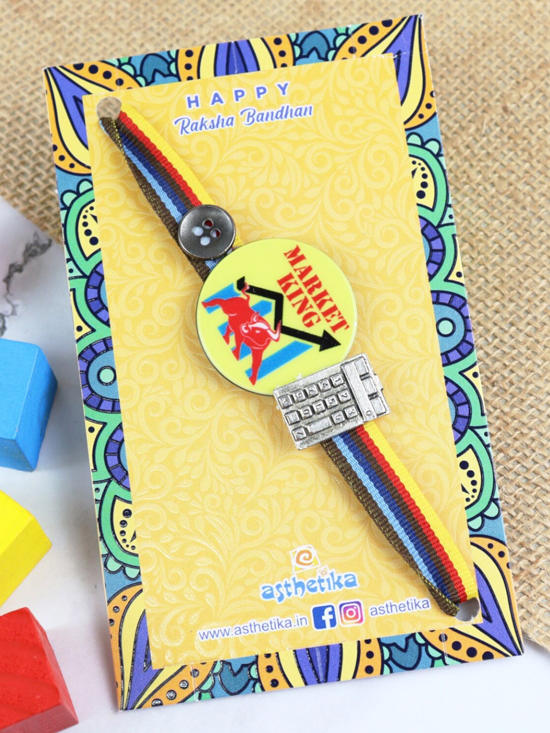 

Asthetika Boys Market King Charm Rakhi, Yellow