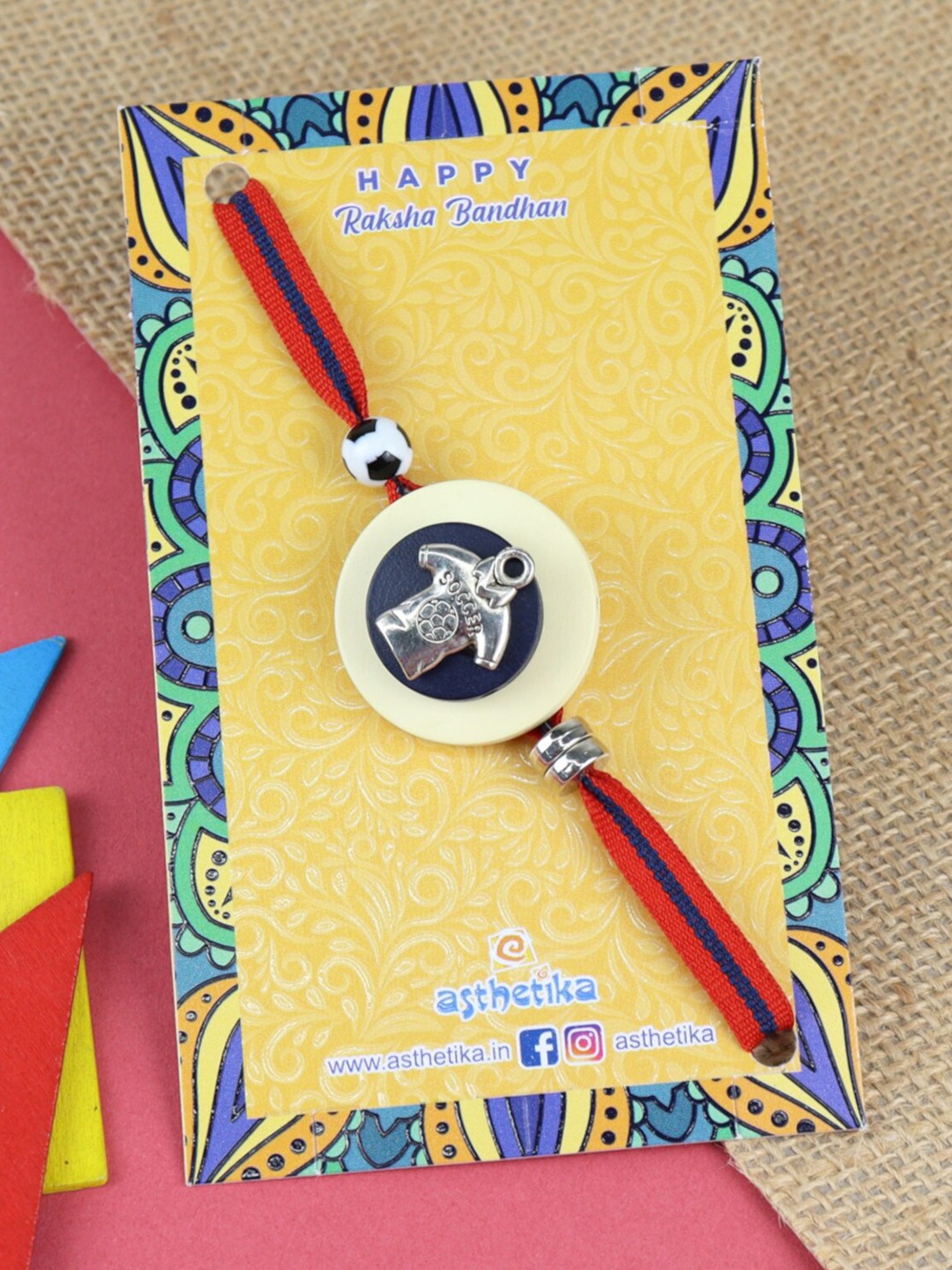 

Asthetika Boys Football Mania Charm Rakhi, Red