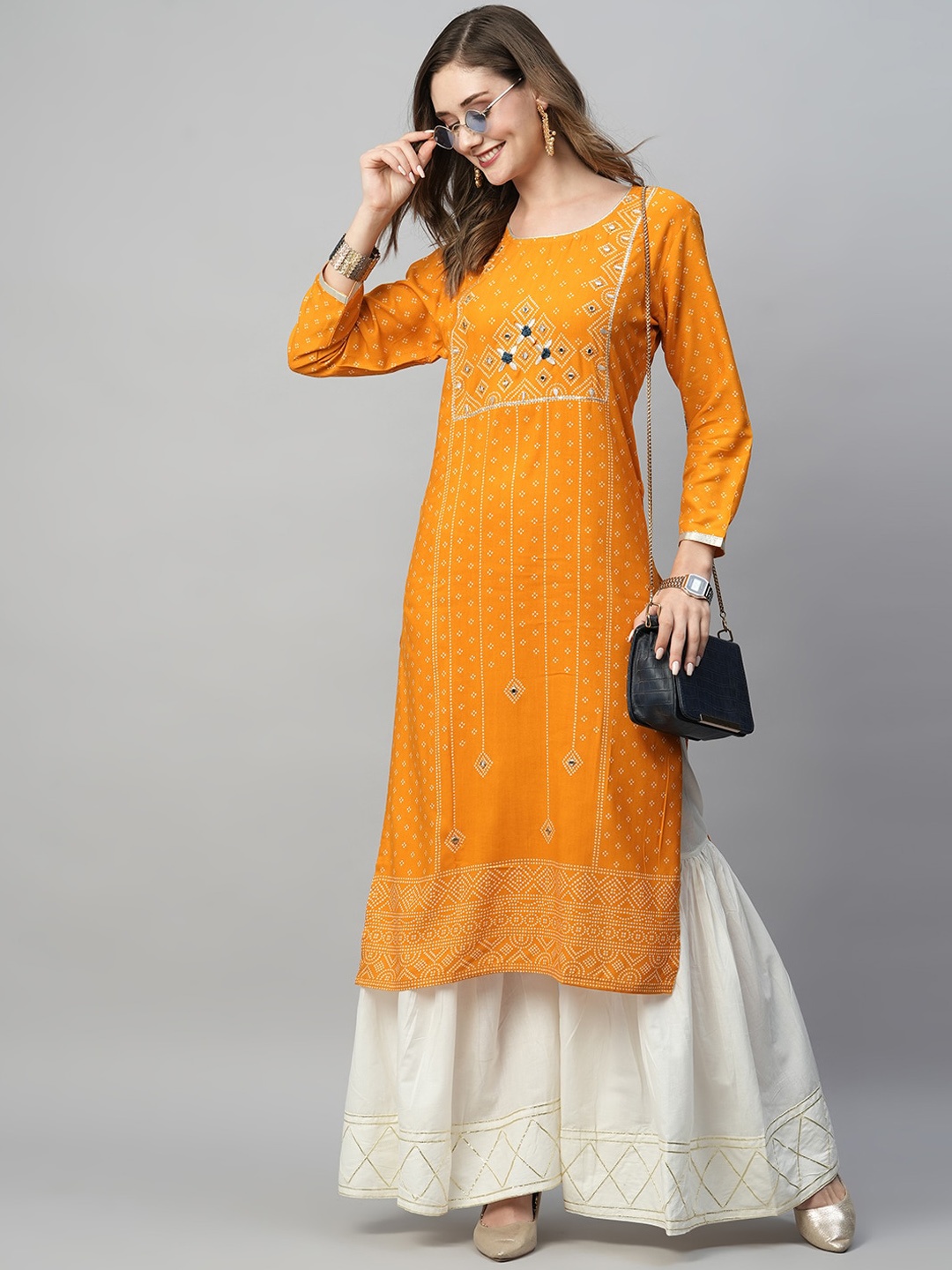 

Kiana Ethnic Motifs Printed Regular Mirror Work Kurta With Sharara, Orange
