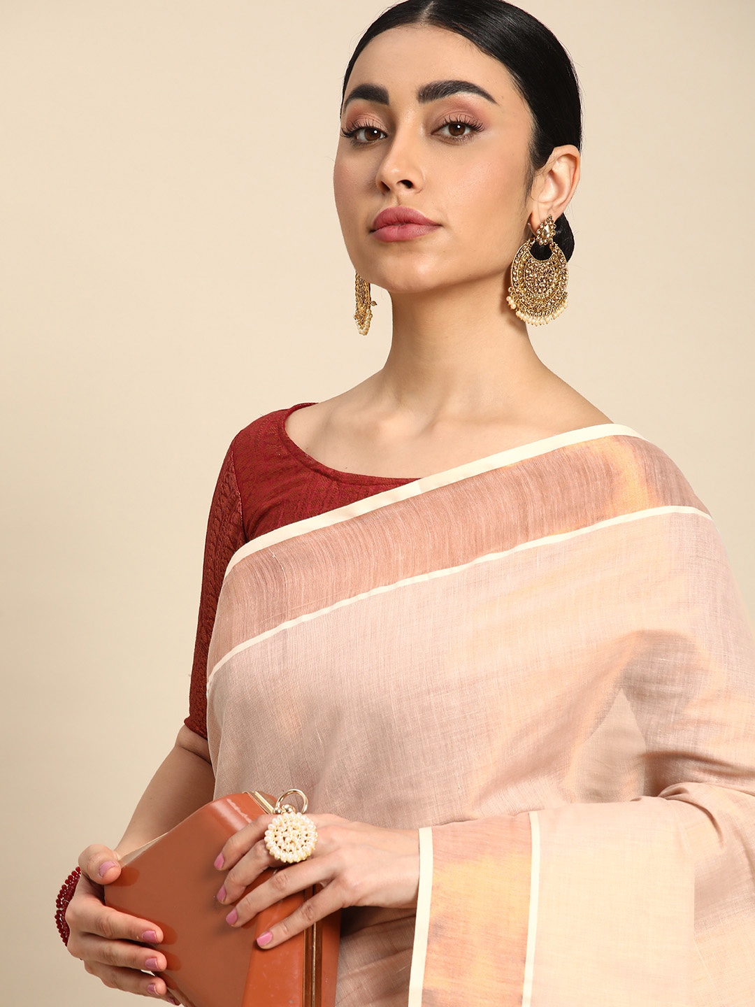 

Kalyan Silks Solid Zari Tissue Kasavu Saree, Copper