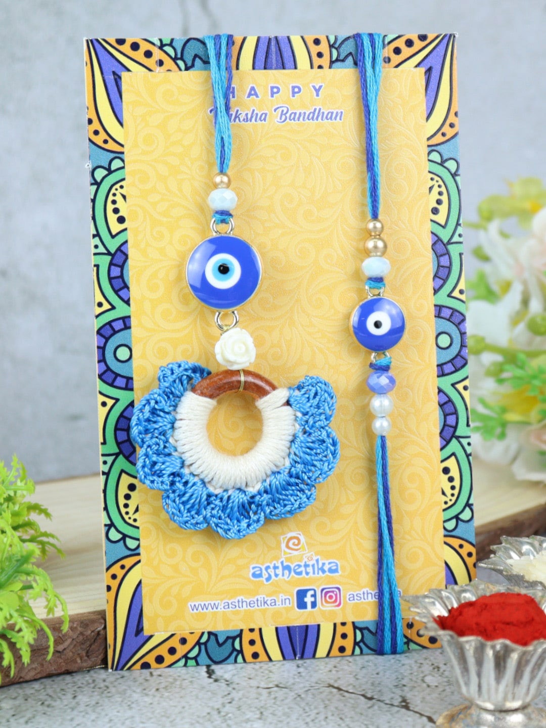 

Asthetika Unisex Set Of 2 Evil Eye & Beaded Thread Rakhis With Roli Chawal, Blue