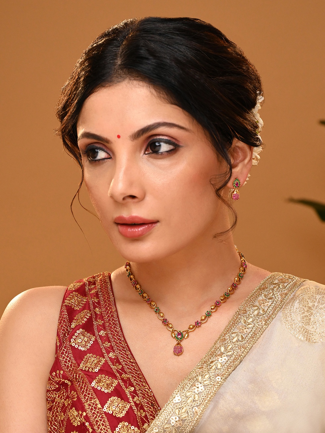 

Vriksham Women Artificial Stones Studded Brass-Plated Jewellery Set, Magenta