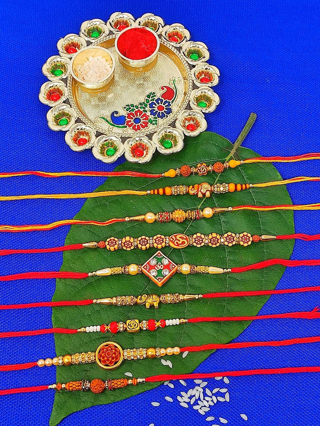 

CRAYTON Set Of 9 Modern Traditional Rakhi Gift Set, Red