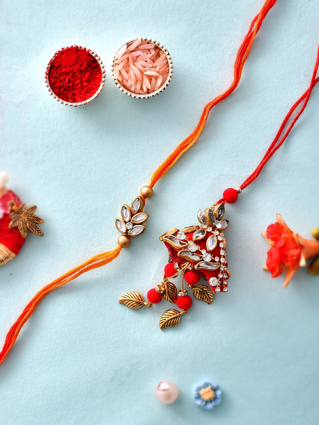

Aapno Rajasthan Unisex Kundan & Stone Studded Bhaiya Bhabhi Rakhi Set., Red