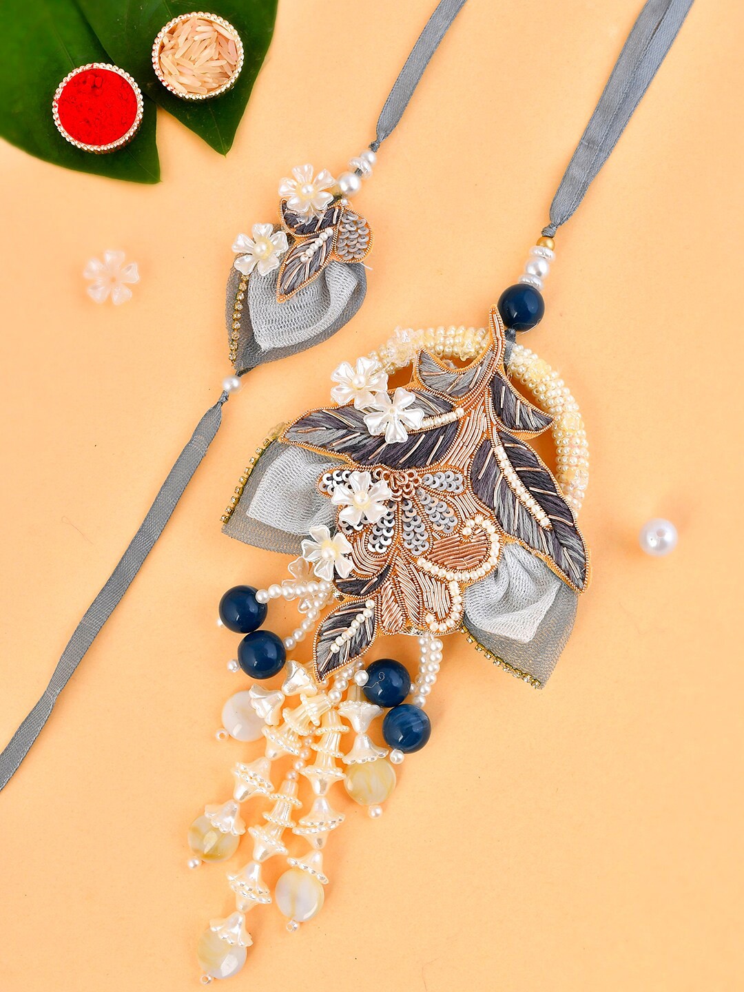 

Aapno Rajasthan Set Of 2 Multi-Embellished Floral Bhaiya Bhabhi Rakhi Set, Grey