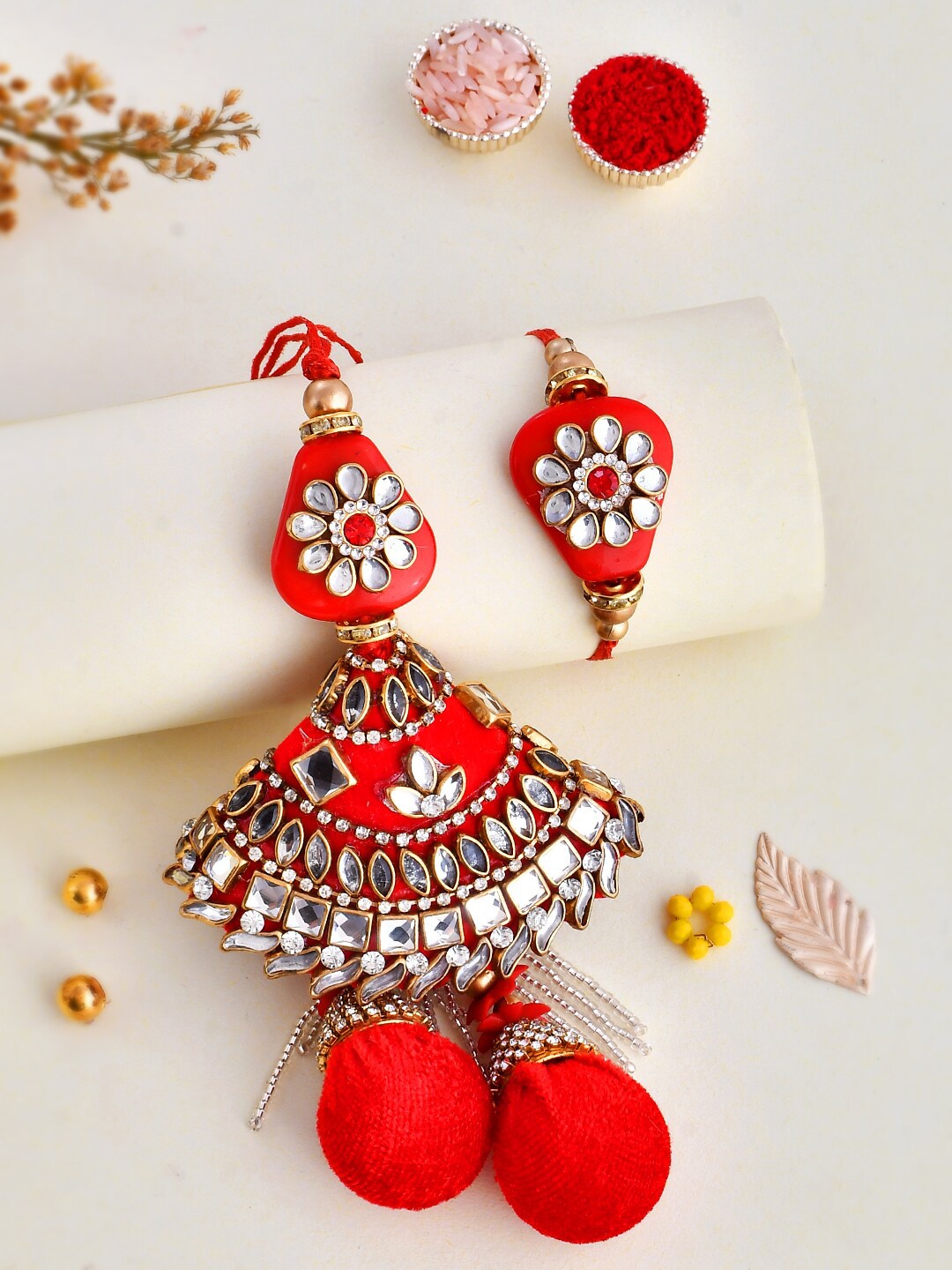 

Aapno Rajasthan Unisex Studded Bhaiya Bhabhi Rakhi Gift Set, Red