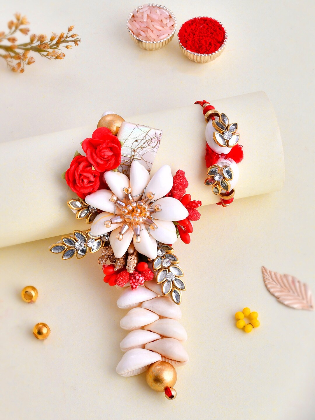 

Aapno Rajasthan Shell & Kundan Crafted Vibrant Bhaiya Bhabhi Rakhi Set., Red