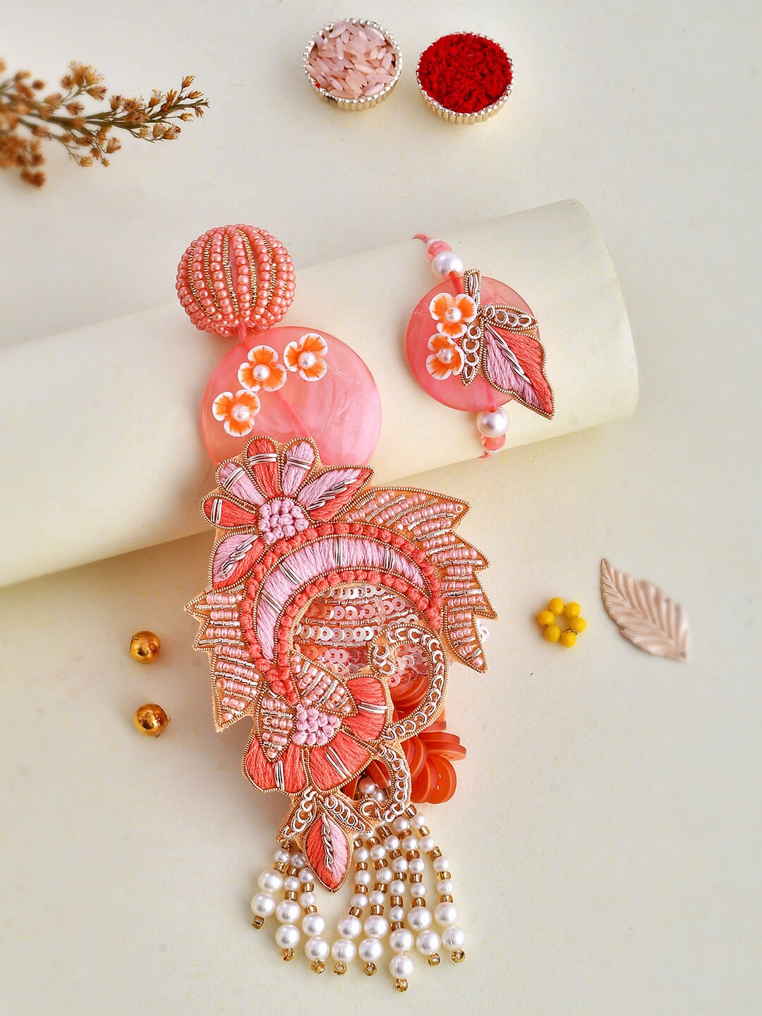 

Aapno Rajasthan Set Of 2 Thread Work Resin Bhai Bhabhi Rakhi Set, Pink