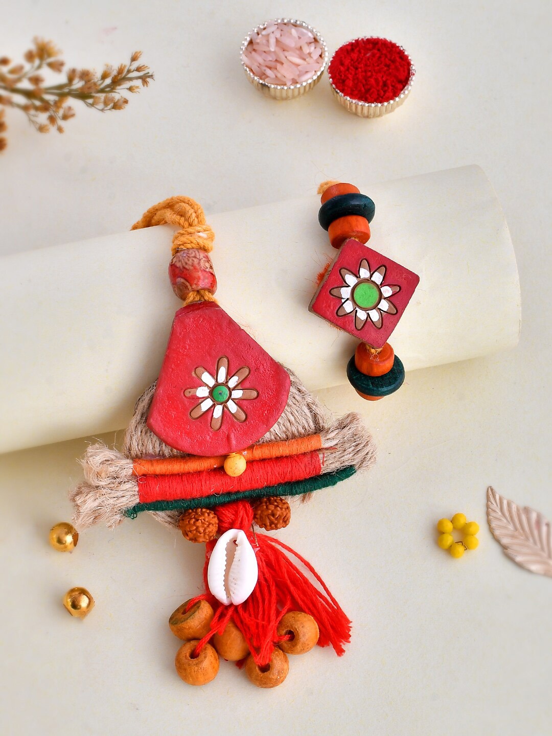 

Aapno Rajasthan Unisex Set Of 2 Embellished & Beaded Rakhi Gift Set, Red