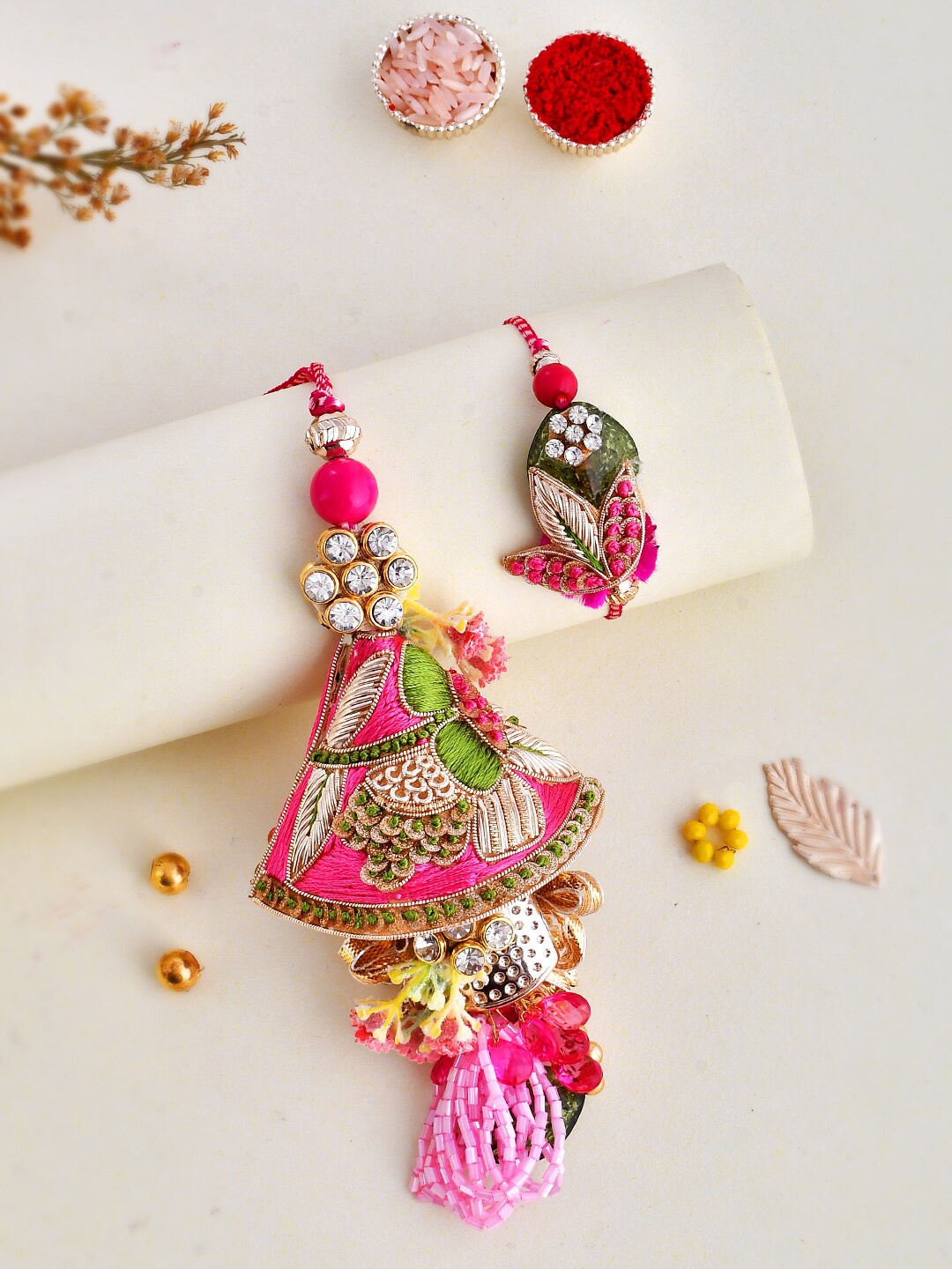 

Aapno Rajasthan Set Of 2 Traditional Thread Work Bhai Bhabhi Rakhi Set, Pink