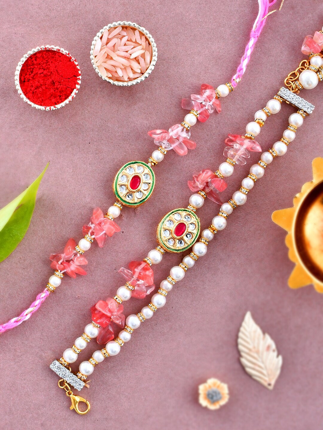 

Aapno Rajasthan Unisex Set Of 2 Stones & Pearl Embellished Rakhi Gift Set, Pink