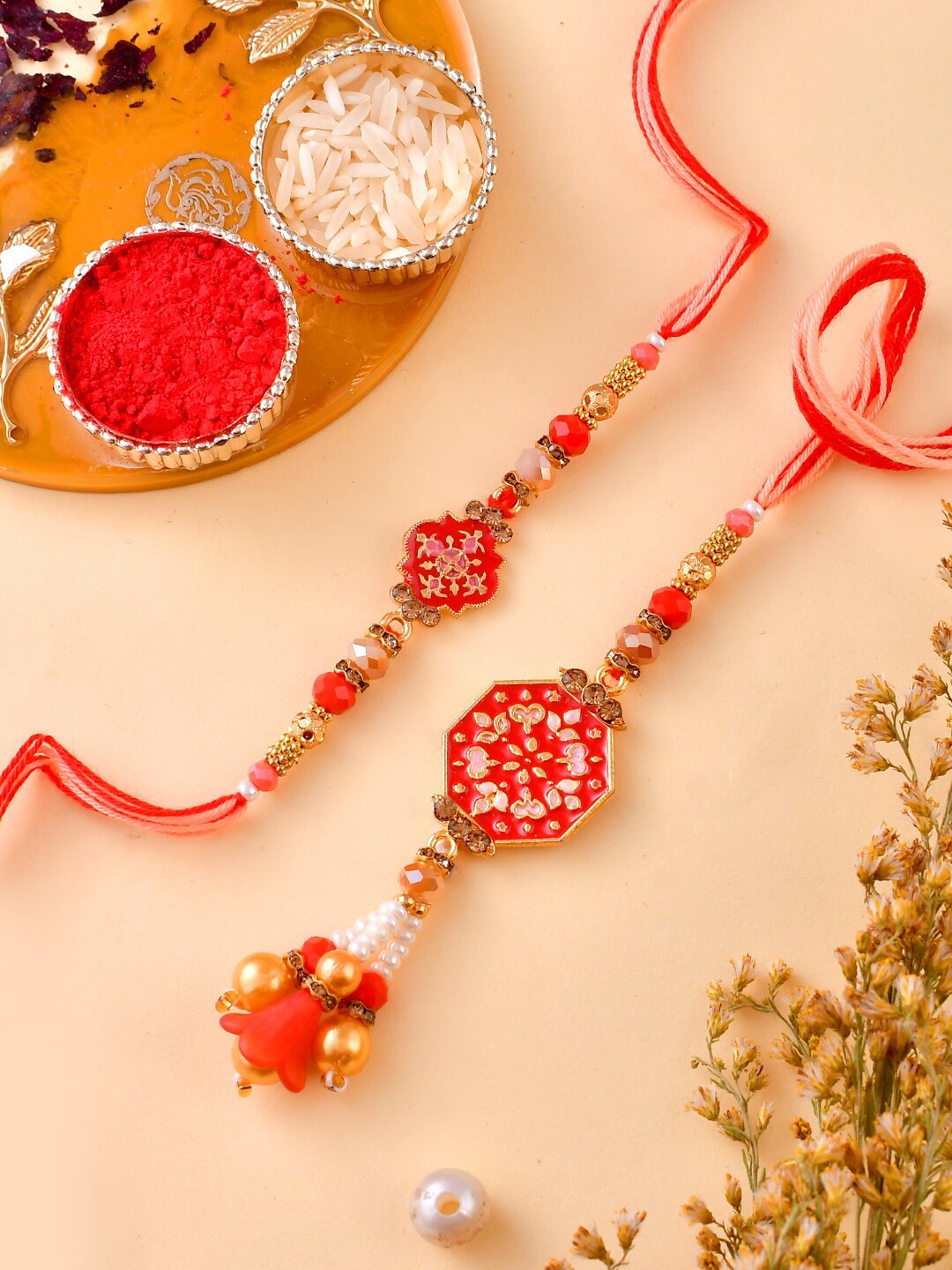 

Aapno Rajasthan Unisex Studded Bhaiya Bhabhi Rakhi Gift Set, Red