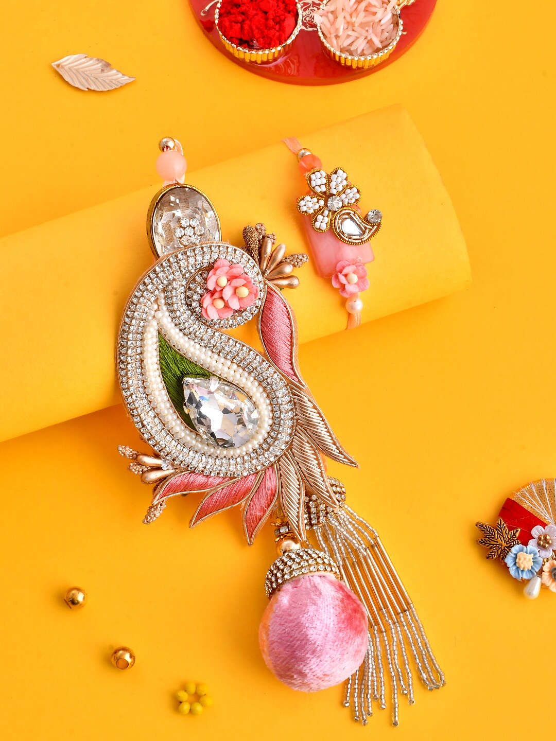 

Aapno Rajasthan Set Of 2 Swarovski Studded Pastel Bhaiya Bhabhi Rakhi Set, Peach