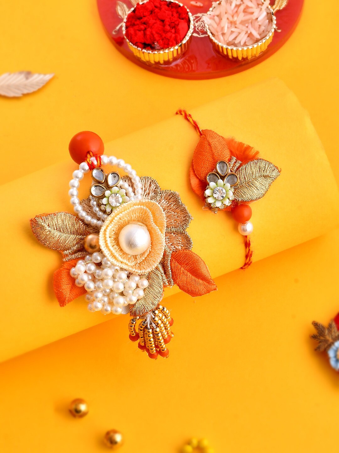 

Aapno Rajasthan Set Of 2 Zari Work Dazzling Beaded Bhai Bhabhi Rakhi Set, Orange