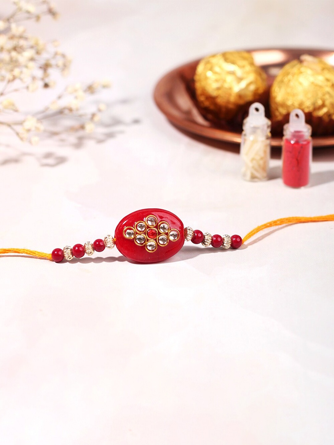 

Happening Hippo Stone-Studded & Beaded Rakhi With Roli Chawal And Greeting Card, Red