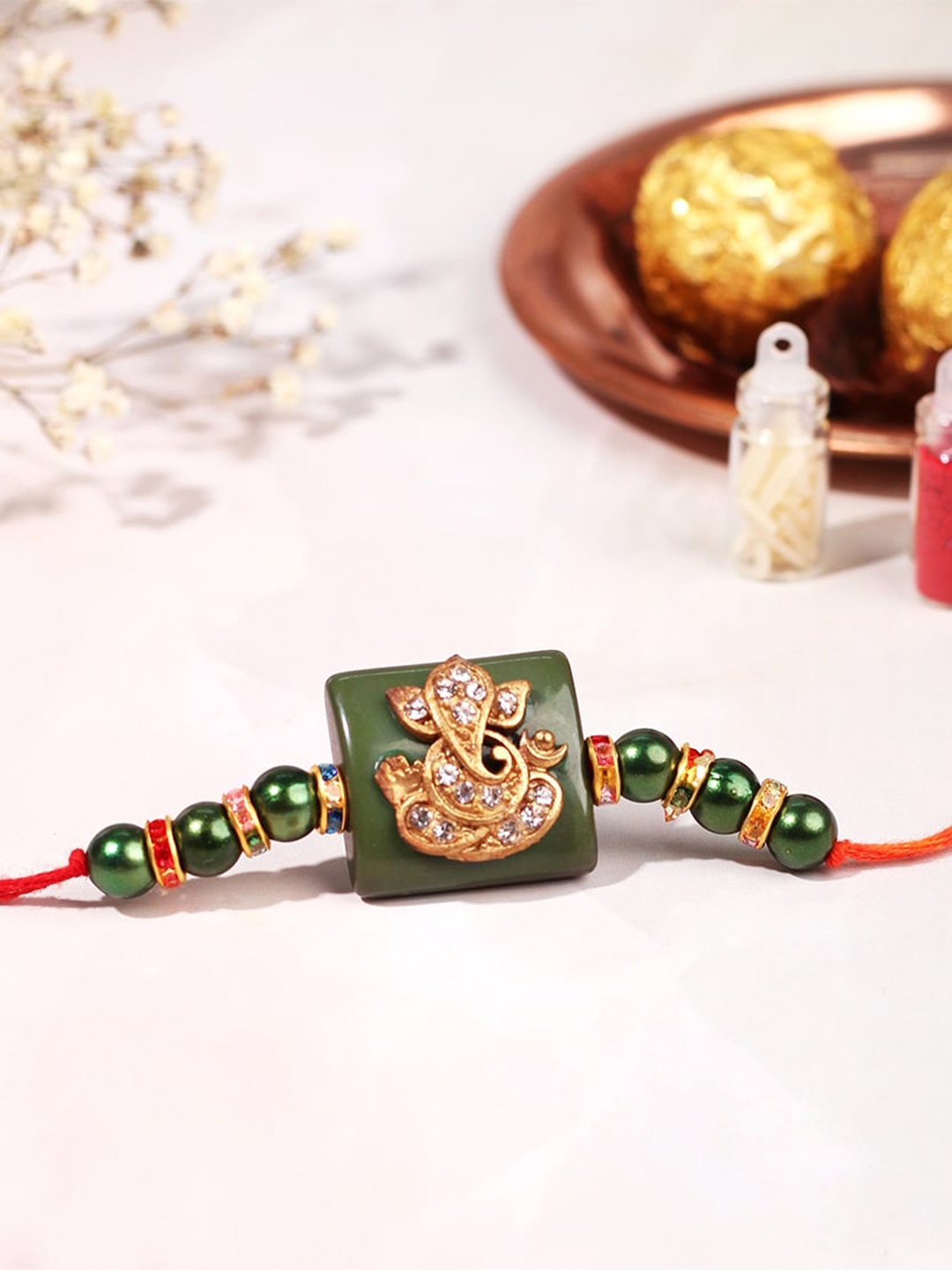 

Happening Hippo Stone-Studded & Beaded Rakhi With Roli Chawal And Greeting Card, Gold