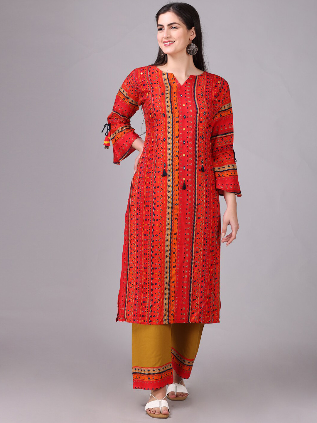

Elthia Geometric Printed Mirror Work Bell Sleeves A-Line Kurta With Trousers, Orange