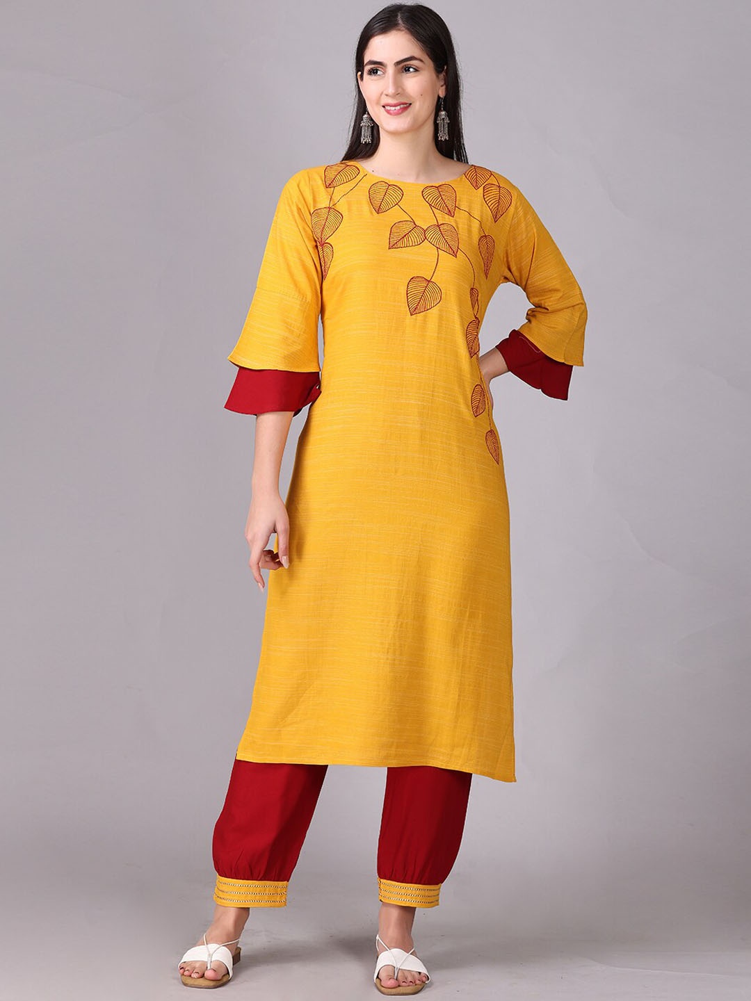 

Elthia Round Neck Floral Regular Yoke Design Thread Work Flared Sleeve Kurta with Trousers, Mustard