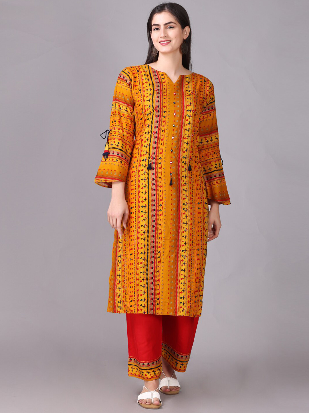 

Elthia Round Neck Ethnic Motif Printed Sequinned Regular Kurta with Palazzo, Mustard