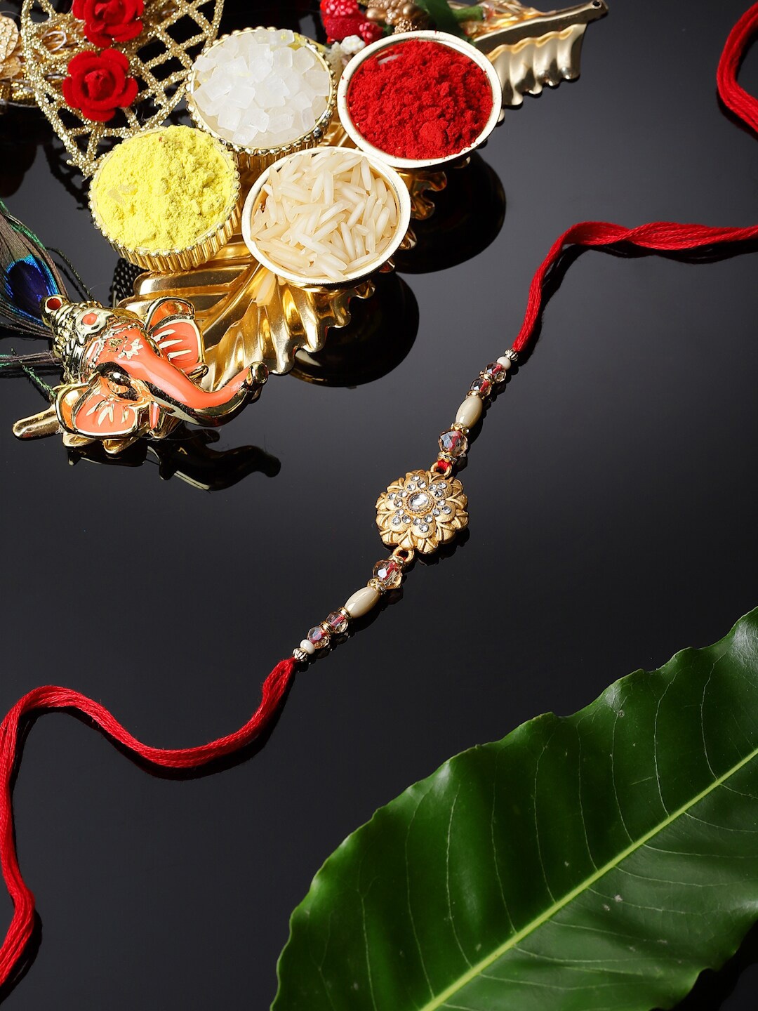 

ZENEME Flower Kundan & Pearl Studded Thread Rakhi, Red