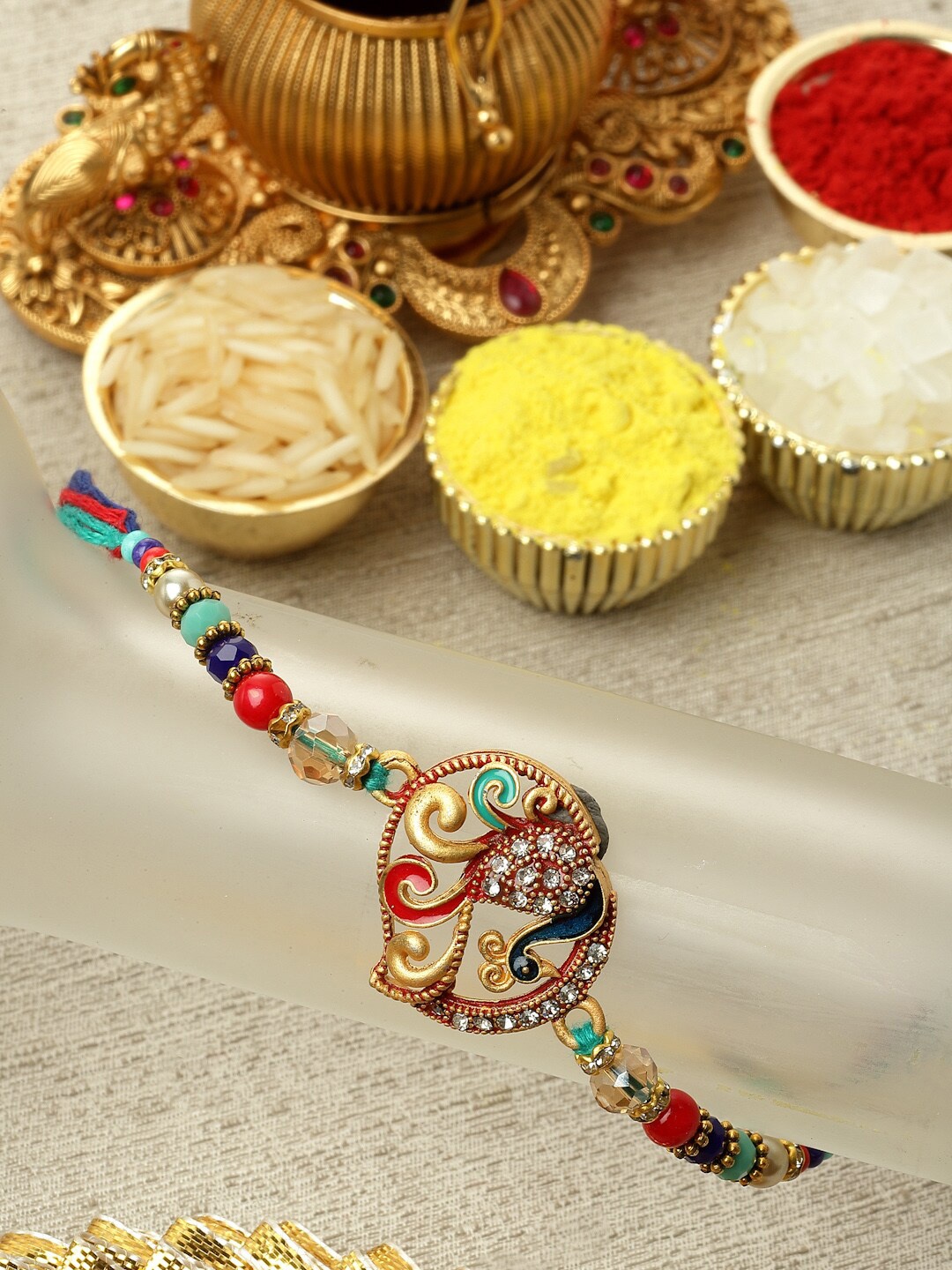 

ZENEME Craved & Enameled Rakhi with Roli and Chawal, Multi