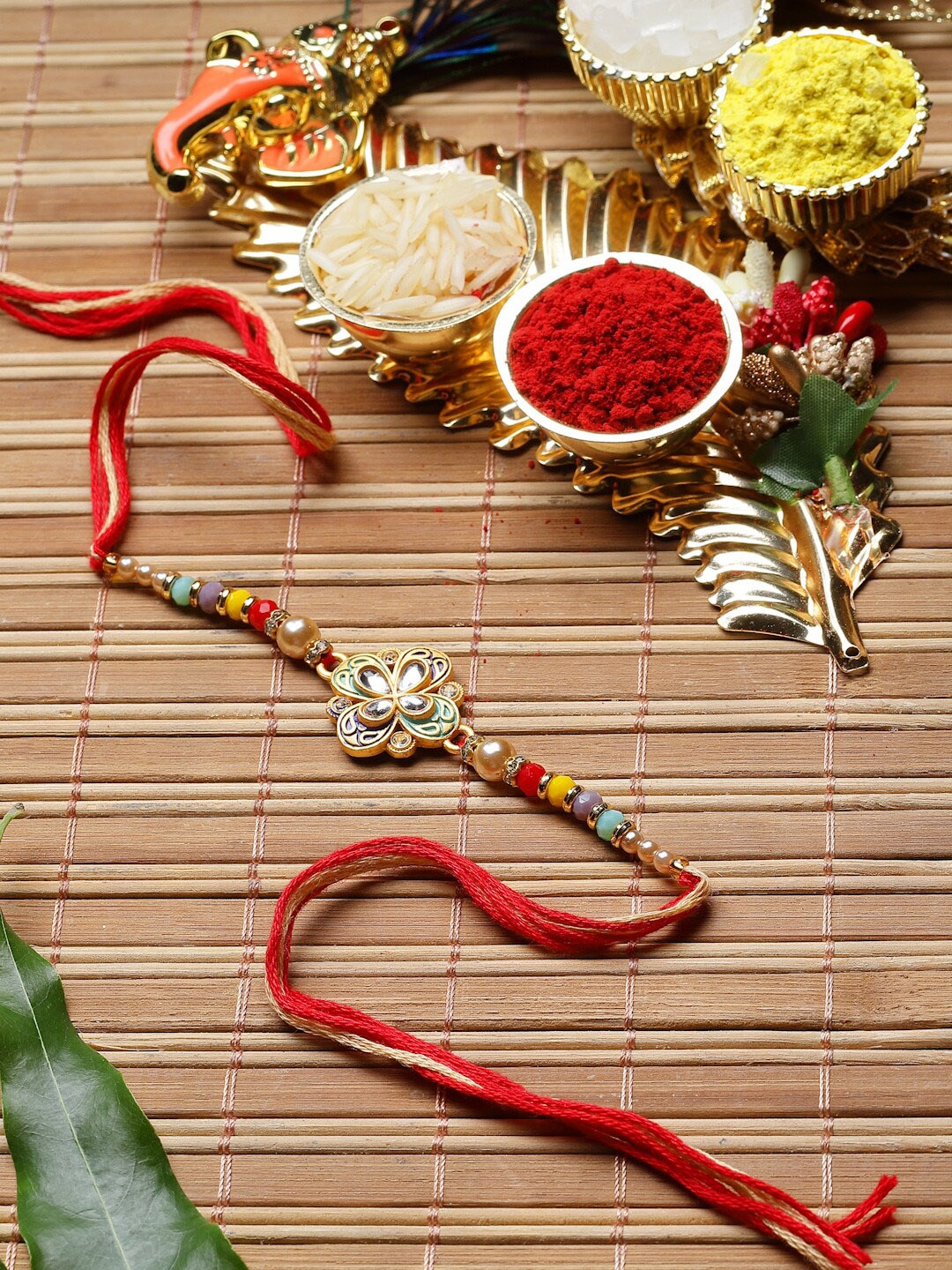 

ZENEME Men Floral shaped Kundan Rakhi With Roli & Chawal, Multi