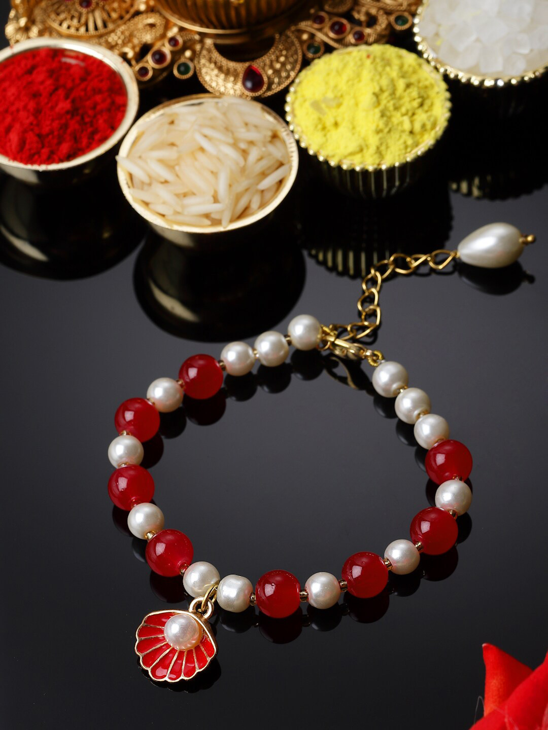 

ZENEME Men Enamelled Oyster Hanging Artifical Stone Studded Lumba Rakhi, Red