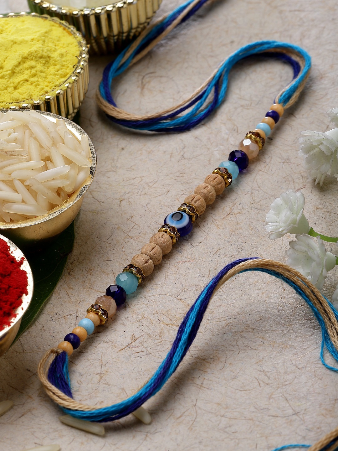 

ZENEME Evil Eye Artificial Beads and Stones Studded Rakhi With Roli Chawal Pack, Blue