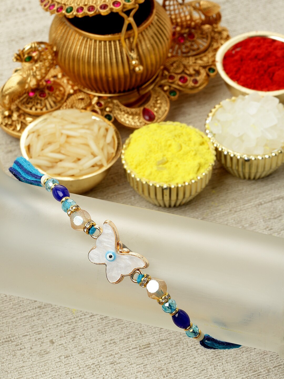 

ZENEME Enamelled Evil Eye Butterfly Shaped Kundan Rakhi Gift Set, Blue