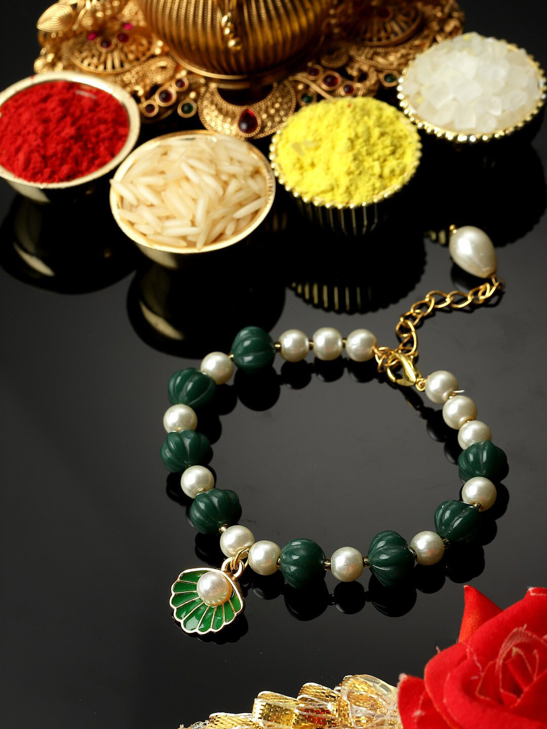 

ZENEME Enamelled Oyster Hanging Artifical Stone Studded Lumba Rakhi, Green