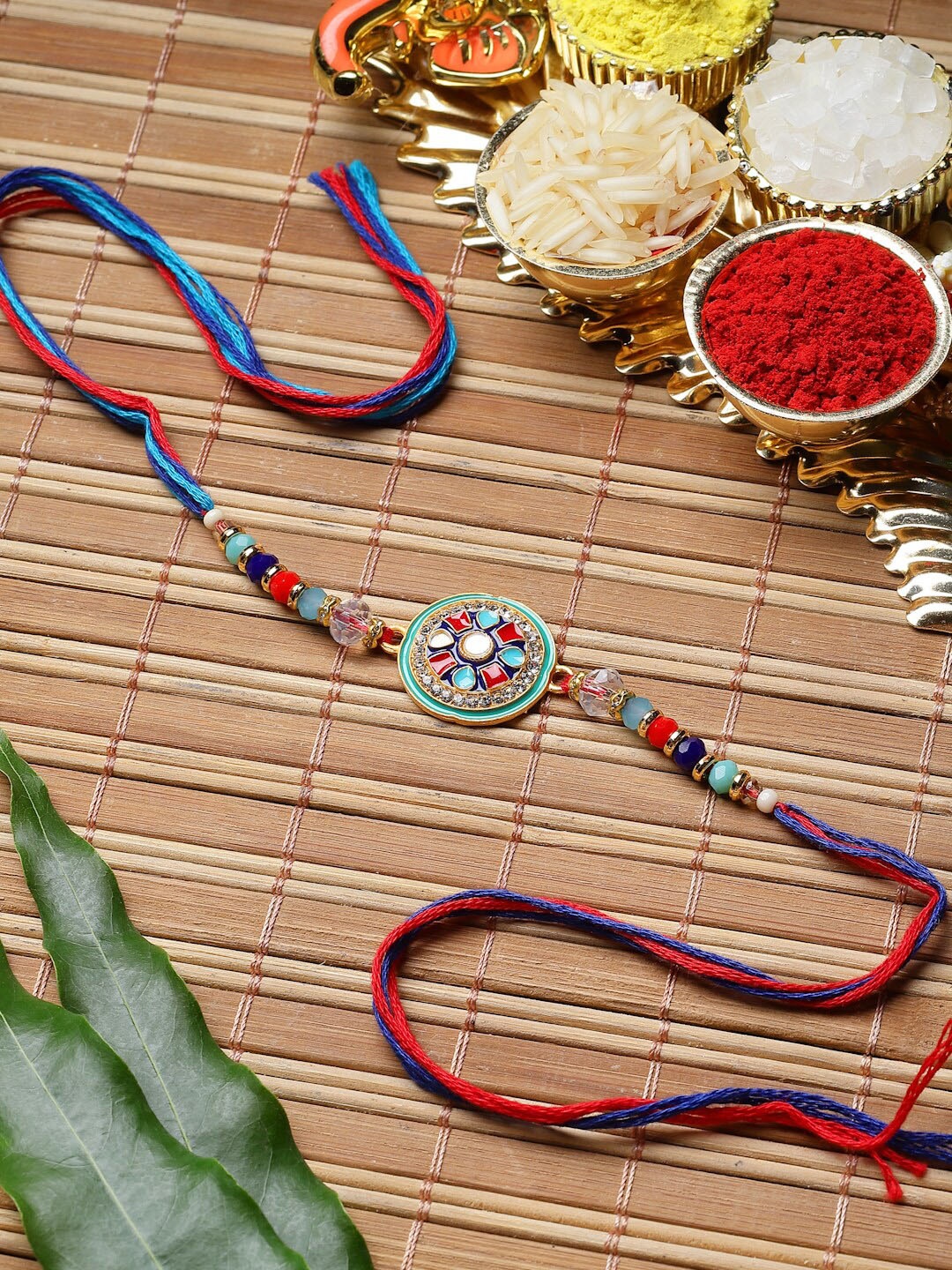 

ZENEME Enameled & Beads Stringed Thread Rakhi With Roli And Chawal, Blue