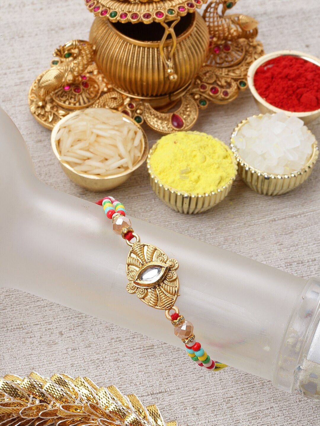 

ZENEME Gold-Toned Kundan Thread Rakhi