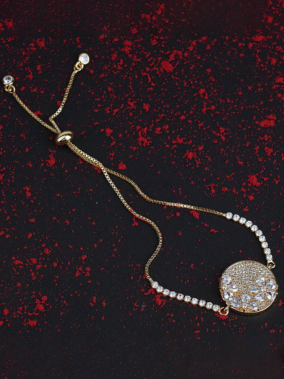 

AURAA TRENDS Gold Plated American Diamond Zircon Rakhi Bracelet