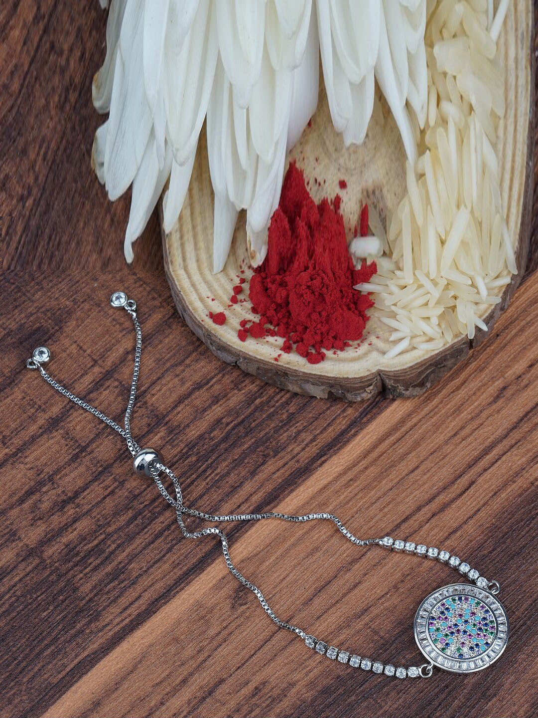 

AURAA TRENDS Women Rhodium-Plated AD Studded Rakhi, Silver