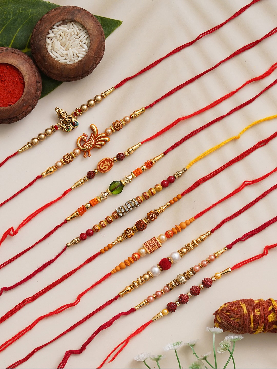 

Anil Rakhi Unisex Set Of 10 Ganesha Designer Rakhi With Roli Chawal, Red
