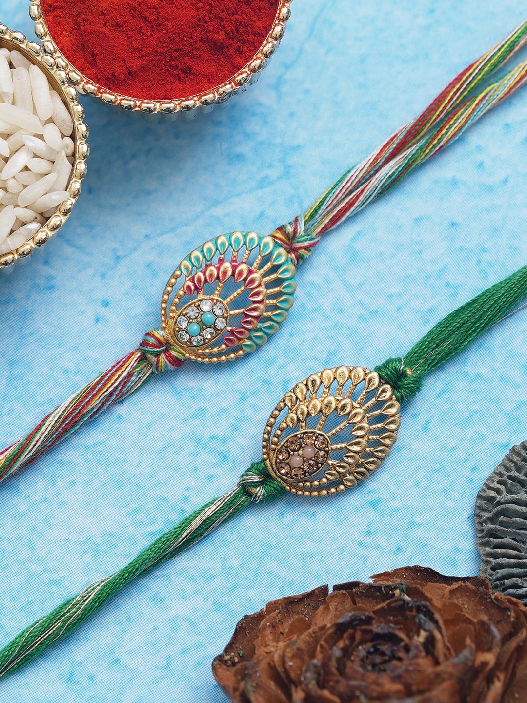 

Anil Rakhi Unisex Set of 2 Colorful Pearls & Designer Rakhi's and Roli Chawal, Green