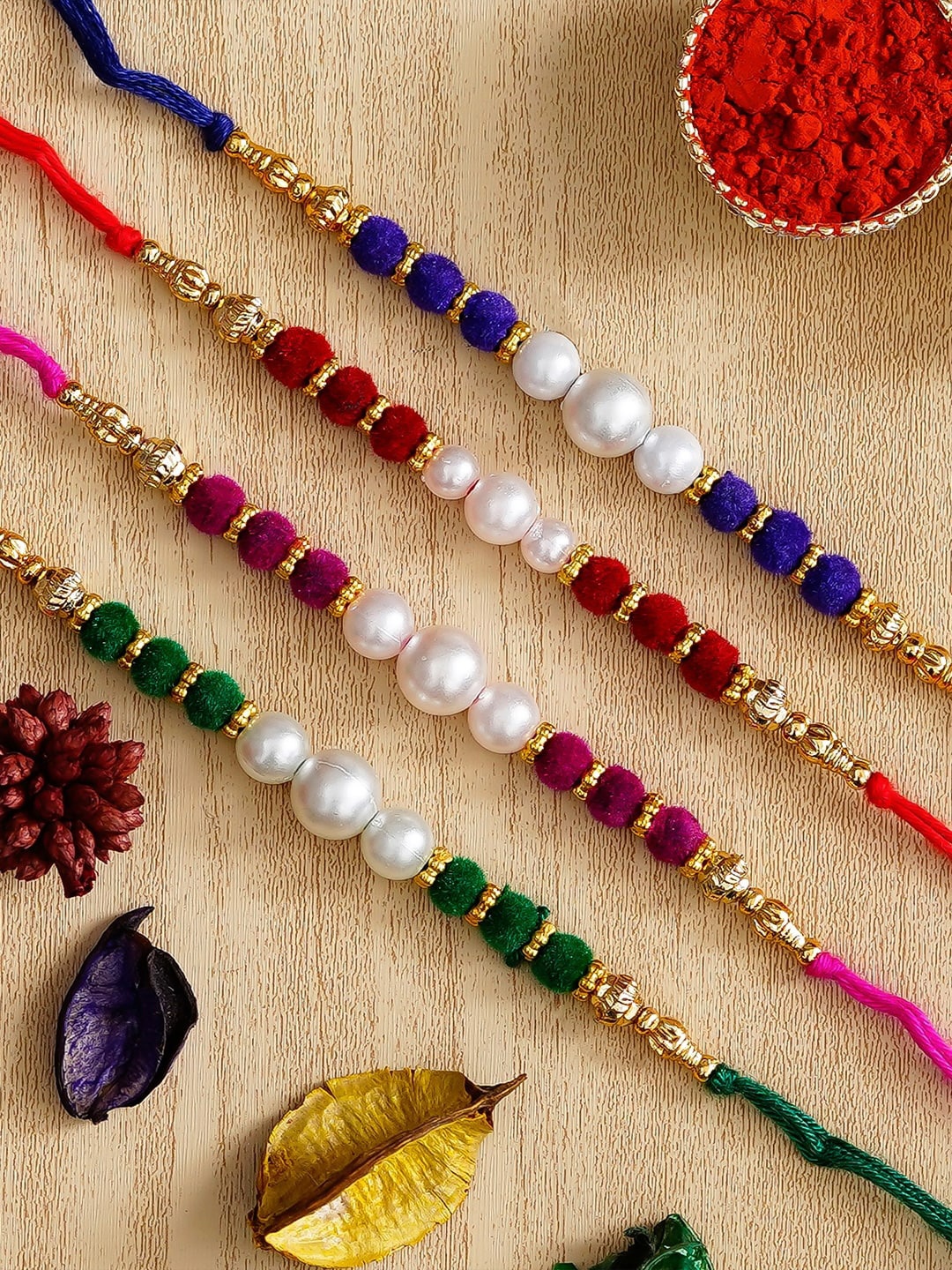 

eCraftIndia Unisex Set of 4 Thread Rakhis With Roli Chawal Pack, Blue