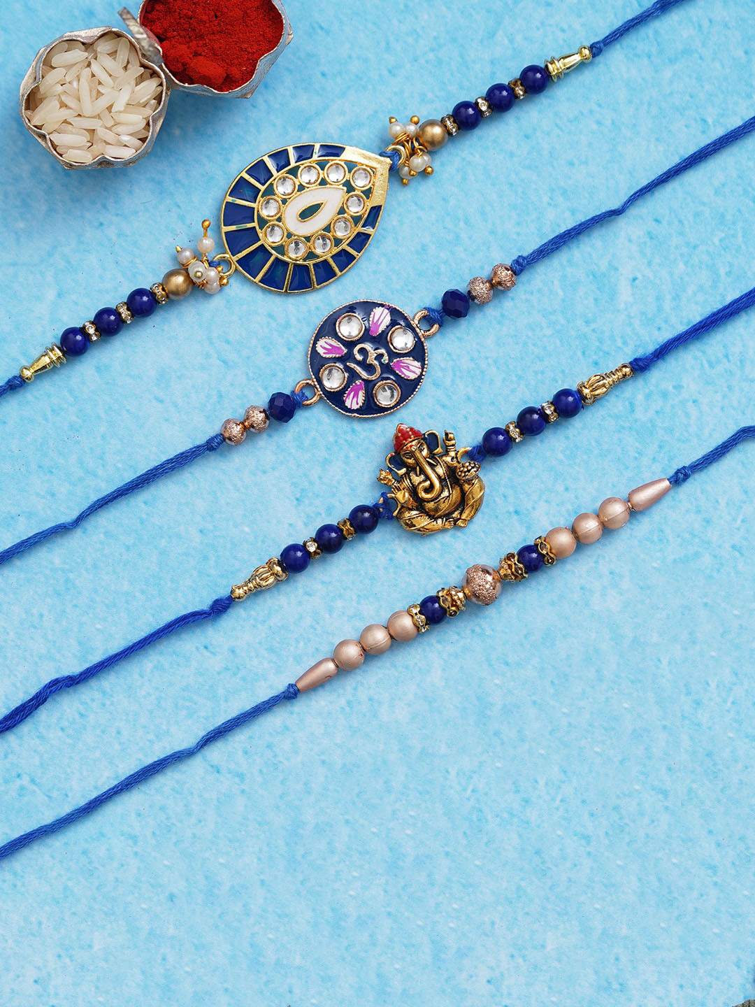 

eCraftIndia Set Of 4 Stone Studded Rakhi With Roli Chawal, Navy blue