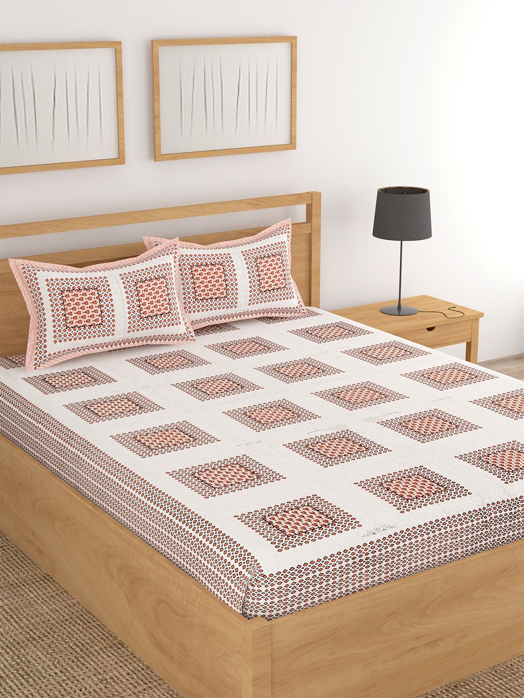 

Lali Prints Peach & White Printed Cotton 180 TC King Bedsheet with 2 Pillow Covers