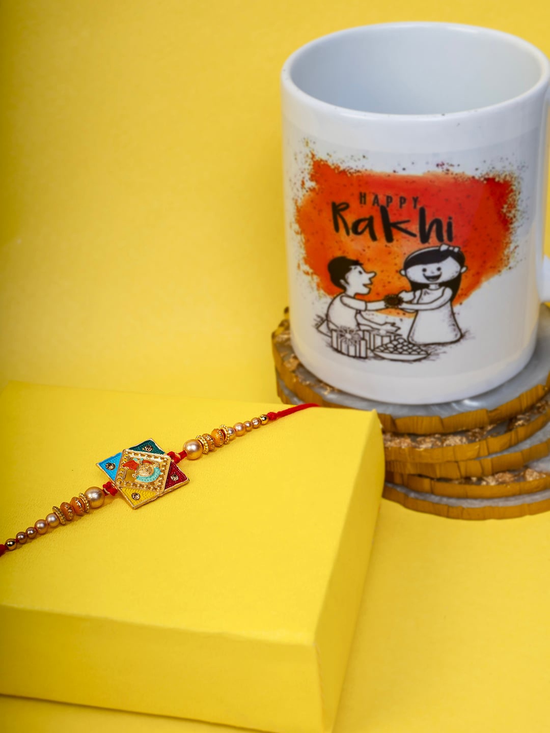 

PANASH Gold-Plated Krishna Thread Rakhi With Mug & Roli Chawal