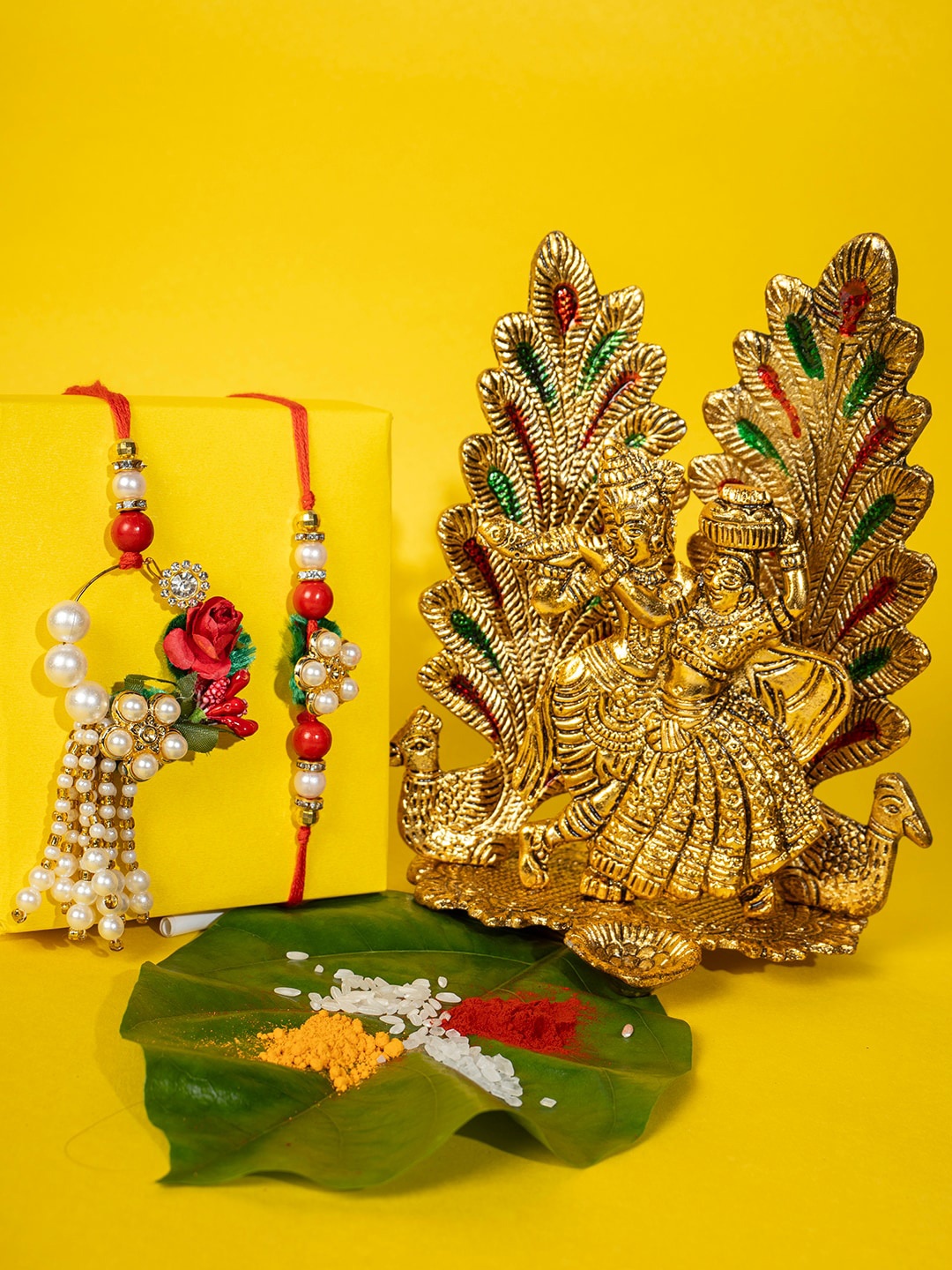 

PANASH Unisex Set Of 3 Gold-Plated Floral Pearl Thread Rakhi - Radha Krishna & Roli Chawal