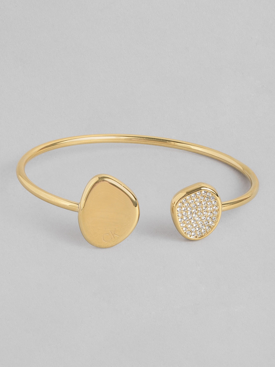 

Calvin Klein Women Fascinate Crystal Stainless Steel Kada Style Bracelet, Gold