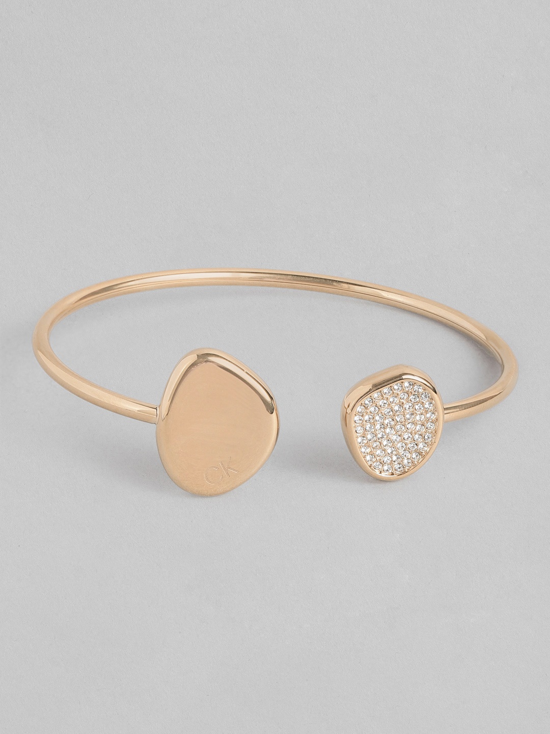 

Calvin Klein Women Fascinate Crystal Stainless Steel Kada Style Bracelet, Rose gold